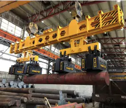 Magnetic spreader for the transport of long products