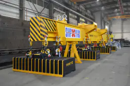 Magnetic spreader for the transport of long products